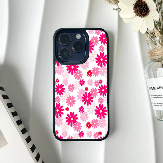 Phone case completely covered in a dense pattern of bright magenta and light pink retro daisies on white.